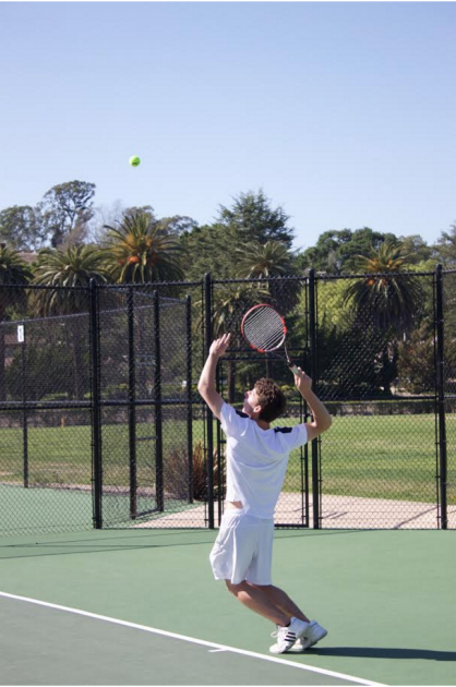 Philip Hicks winds up to serve an ace in a singles match. 