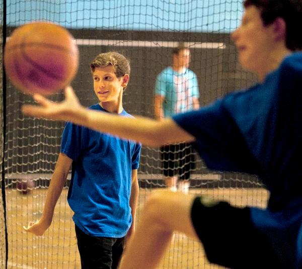Ryan McCormick, 15, of Laguna Niguel, on the court at the YMCA on Sunday morning.

///ADDITIONAL INFO: 13.ocr.family_cover.0923.db.jpg -- 9/14/14 -- PHOTO BY DAVID BRO, CONTRIBUTING PHOTOGRAPHER----The Basketball Buddies --- OC Family Cover ---