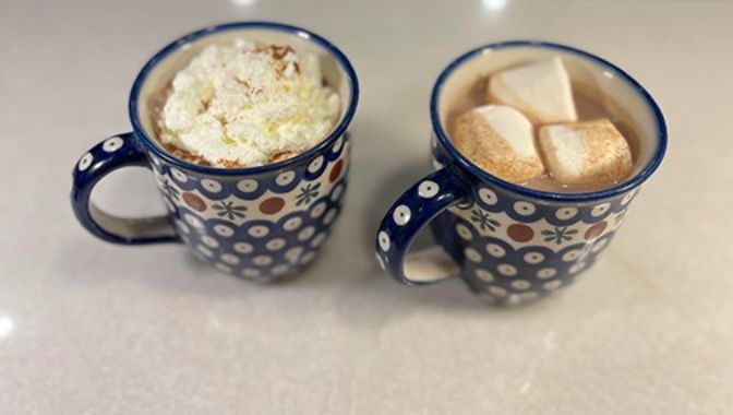 A cup of hot cocoa with marshmallows is perfect on a cold day.