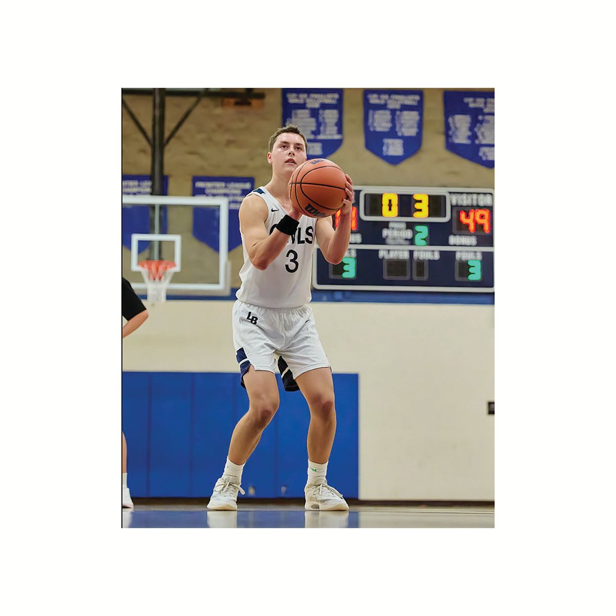 Max Miller takes a dribble and focuses on his free throw.