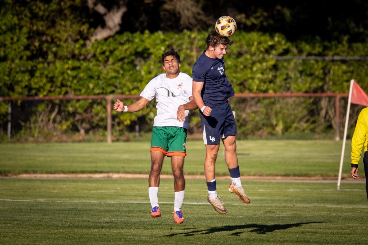 Senior Beckett Smythe flies over an innocent Thacher striker.